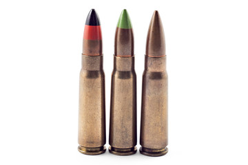 A selection of 7.62 bullets for kalashnikov, isolated on white. Bullets of different types: tracer, armor piercing...