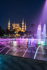 Fototapeta na wymiar Long exposure photography at Sultanahmet Mosque with fountain in the foreground during Ramadan Mont at Sultanahmet Park, Istanbul, Turkey.