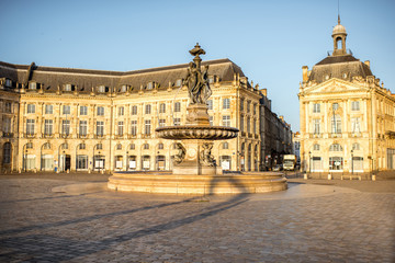 Fototapeta na wymiar View on the famous La Bourse square with fountain during the morning in Bordeaux city, France