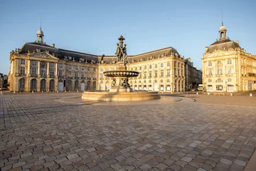 Fotobehang View on the famous La Bourse square with fountain during the morning in Bordeaux city, France © rh2010