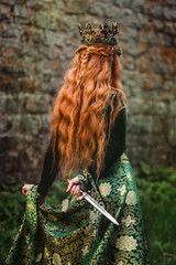 Woman in green medieval dress © grape_vein