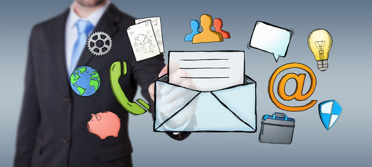 Businessman drawing manuscript contact icon with a pen