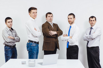 Group portrait of five business people on white background