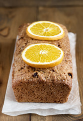 Christmas spicy cake with orange and cinnamon Holiday background Winter Fruit cake Vertical photo
