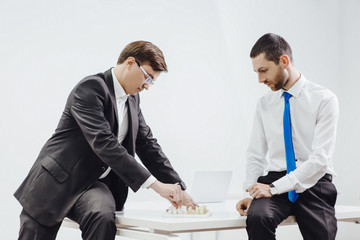Two business partners playing chess at office