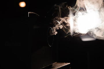lights in smoke, studio lights shining through the smoke from smoke machine.