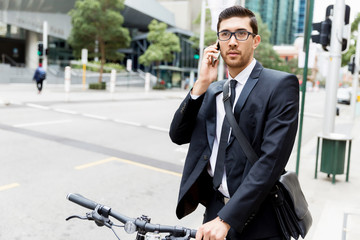 Young businessmen with a bike