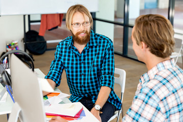 Two office workers at the desk