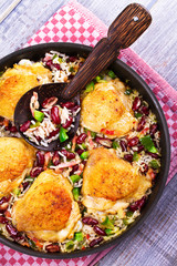 Chicken with Rice, Beans, Bacon and Green Pepper in Pan. View from above, top studio shot