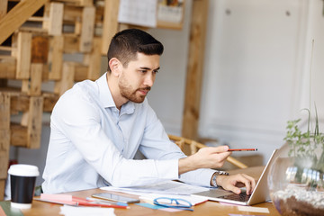 Young man architect in office