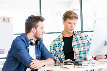 Young office workers discussing