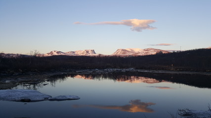 Midnight sun over the mountains in Abisko