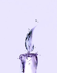 A lighted violet water candle for relaxation.