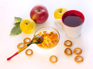 breakfast with apples, bagels, tea and homemade jam, isolated on white