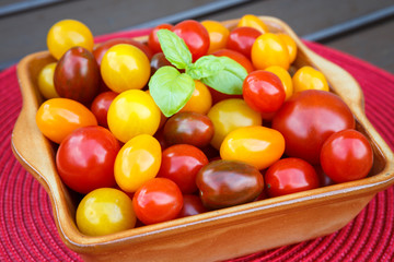 Different colorful cherry tomatoes. Healthy eating or vegetarian concept.