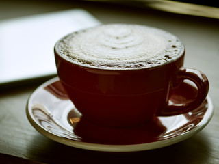 coffee or latte in a coffee cup