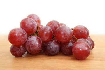 red grapes , Grapes on a wooden table