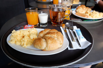 Breakfast served with Scrambled eggs, juice, Croissant in hotel, Thailand