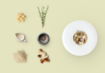 Cooking ingredients for italian risotto with wild mushrooms isolated on yellow