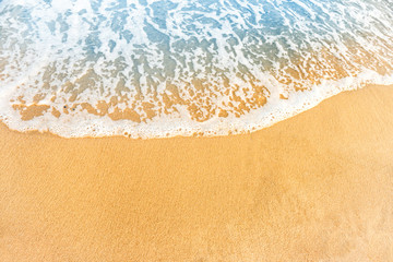 Beach sand and ocean wave