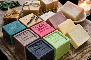 Various colored olive oil soaps on sack cloth