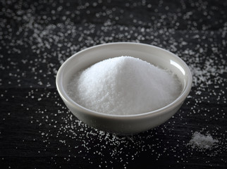 white salt on black background