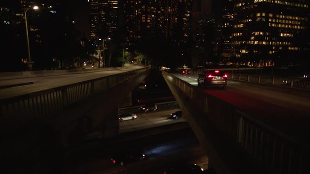 Freeway traffic in downtown Los Angeles at night. Evening Rush Hour Traffic. 4K