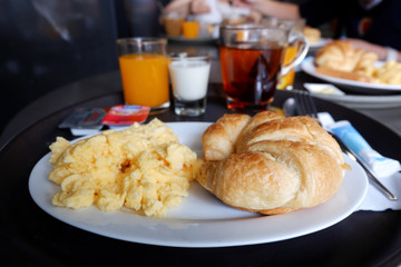 Breakfast served with Scrambled eggs, juice, Croissant in hotel, Thailand