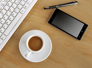 cup of coffee on the table with keyboard 