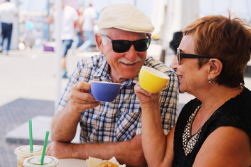 Portrait of senior couple sitting in summer cafe - 163792448