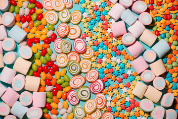 Fototapeta na wymiar Colorful marshmallow candies and jellies as background