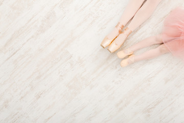 Ballerinas in pointe ballet shoes, graceful legs