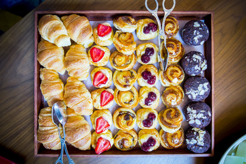 Colorful breakfast - homemade waffles, granola,muffins,almond,hazelnuts,various fresh fruits, berries on a old wooden table. Health food concept