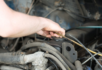 Male mechanic dismantle car in emergency condition.