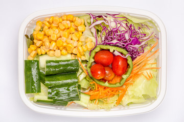 A box of mixed fresh vegetables salad, diet and healthy food concept.