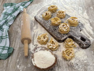 Fototapeta na wymiar Italian homemade pasta on a wooden table. 
