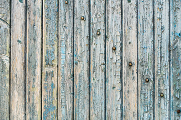 Old wood planks with paint peeling off.