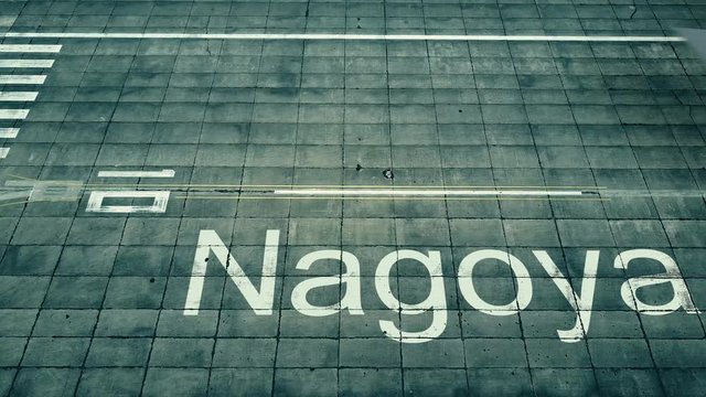 Aerial view of big airplane arriving to Nagoya airport. Travel to Japan conceptual intro animation