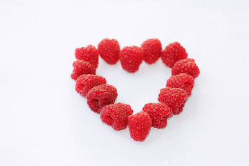 A heart of fresh picked raspberries