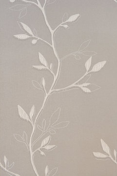 Textured background with a vegetative pattern in the form of a branch with leaves.