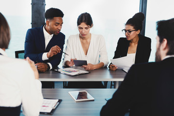 Team of businessmen work together in office. Concept of teamwork and partnership