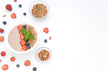 Diet concept frame porridge, nuts, fresh berries. Top view. Copy space