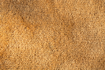 Close up of an orange carpet as a background