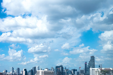 Fototapeta na wymiar Sky & clouds background with city view at bottom part.