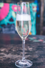 Close up of a glass of champagne in cafe, Bali island, Indonesia.