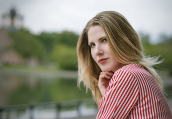 Outdoors portrait of beautiful young woman. Selective focus.