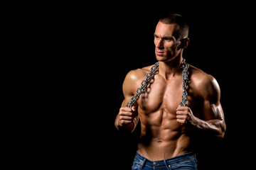 fitness muscular male model with chains