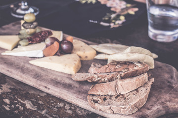 Cheese plate with several varieties of cheese in the restaurant of Bali island, Indonesia.