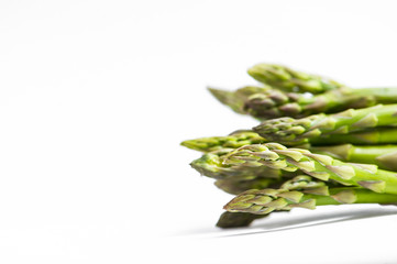 Fresh green asparagus on white