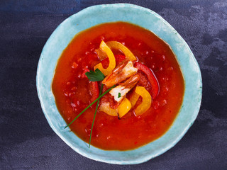 Shrimp Gazpacho with Red and Yellow Bell Pepper. Spanish soup. Vegetable puree with prawns. View from above, top studio shot